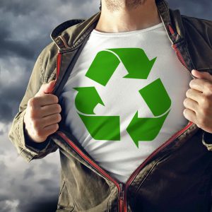 Man stretching jacket to reveal shirt with recycle symbol printed. Concept of environmental conciousness and natural preservation.